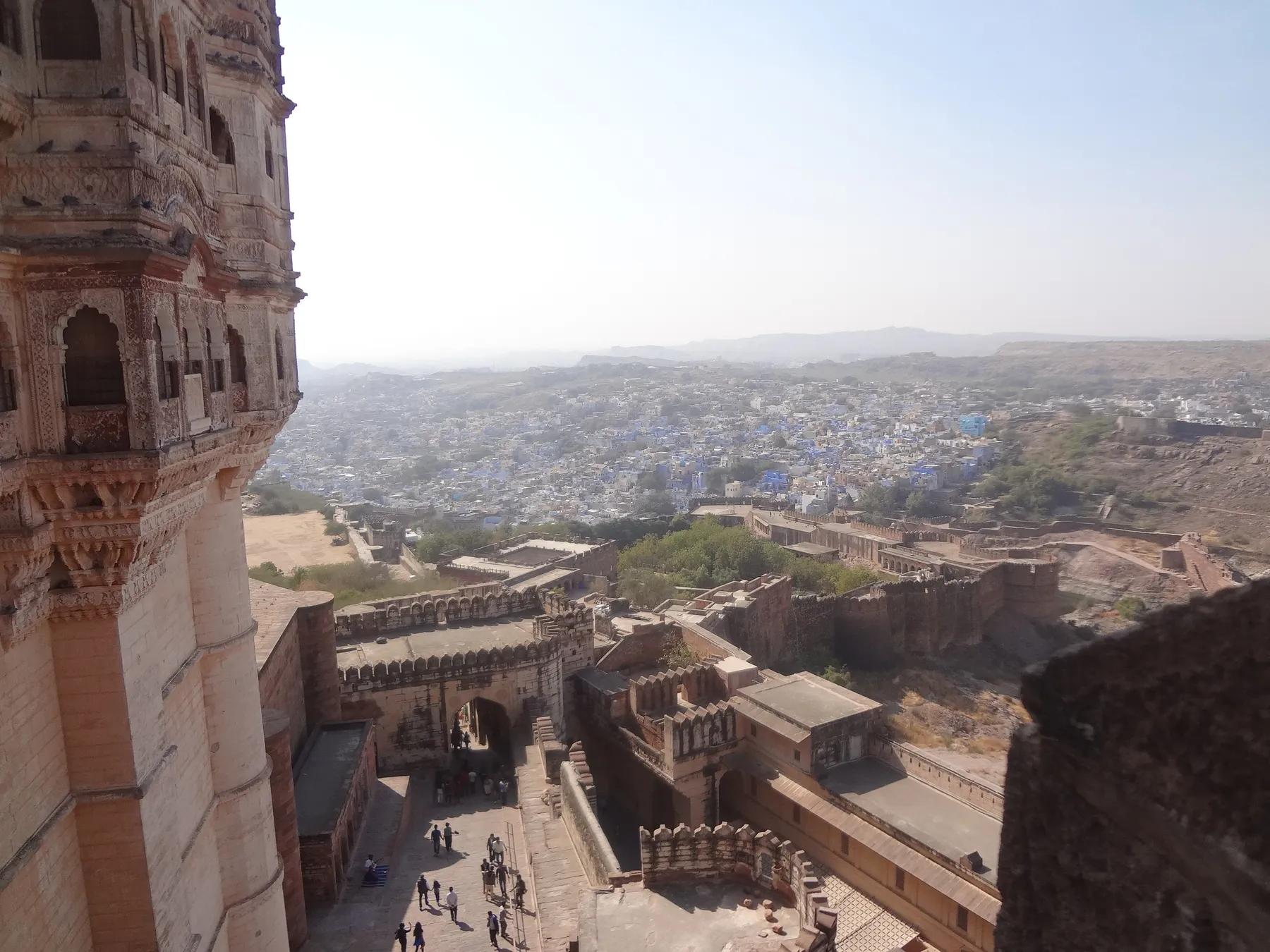 Blue houses and desert haze seen from fort ramparts